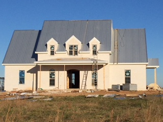 New construction home in Troy, Alabama has a metal roof installed by Trotman Brothers Roofing.